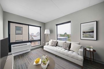 Philadelphia apartment for rent - A living room with a couch, a coffee table, and a painting on the wall.