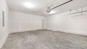 Hastings house for rent - A spacious room with a grey floor and white walls.