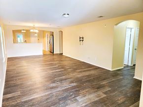 Temple house for rent - A room with wooden floors and a white counter.