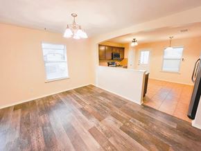 Temple house for rent - A kitchen area with a refrigerator, microwave, and oven.