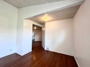 Sweeny house for rent - A room with wooden floors and white walls.
