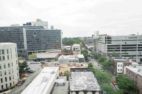 Philadelphia apartment for rent - A city street with cars and buildings.