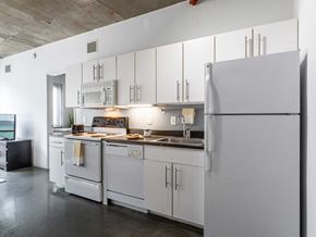 Philadelphia apartment for rent - A modern kitchen with white appliances and cabinets.