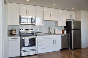 Philadelphia apartment for rent - A kitchen with white cabinets and stainless steel appliances.