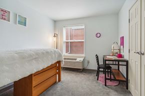 Philadelphia apartment for rent - A bedroom with a bed, desk, and chair.