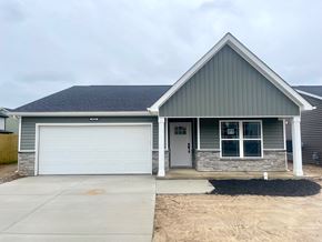 Louisville house for rent - A house with a grey roof and a white garage door.