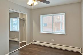 Forest Park apartment for rent - A room with a window and a ceiling fan.