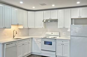 Forest Park apartment for rent - A kitchen with white appliances and cabinets.