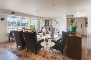 Longmont apartment for rent - A living room with a round table and chairs.