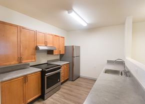 Longmont apartment for rent - A kitchen with wooden cabinets and stainless steel appliances.