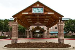 Longmont apartment for rent - The entrance to a hotel named The Suites.