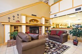 Longmont apartment for rent - A living room with a fireplace and two couches.
