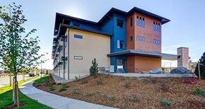 Longmont apartment for rent - A modern house with a blue and orange exterior.