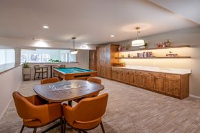 Longmont apartment for rent - A room with a pool table and orange chairs.