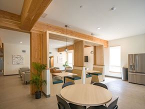 Longmont apartment for rent - A modern dining area with a wooden table and chairs.