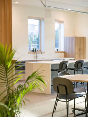 Longmont apartment for rent - A modern kitchen with a dining table and chairs.