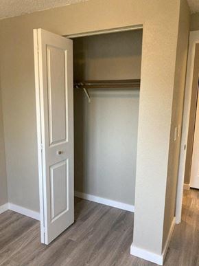 Richland house for rent - A white door is open to a small closet.