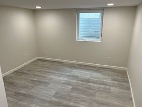 Kennewick house for rent - A room with a window and a wooden floor.