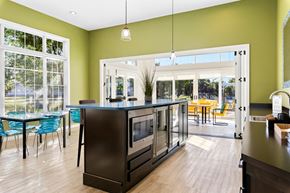 Murfreesboro apartment for rent - a kitchen with an island and a dining room with a table and chairs
