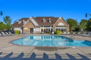 Murfreesboro apartment for rent - a swimming pool with a house in the background