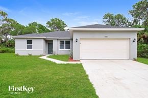 Palm Bay house for rent - A two-story house with a garage is for sale.