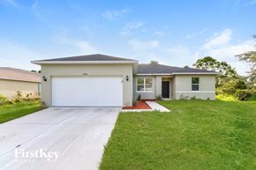 Palm Bay house for rent - A two-story house with a garage is for sale.