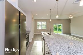 Palm Bay house for rent - A kitchen with a FirstKey Homes sign on the fridge.