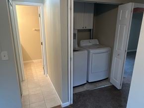 Kennewick house for rent - A white washer and dryer are in a small room.