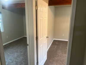Kennewick house for rent - A room with a white door and carpeted floor.