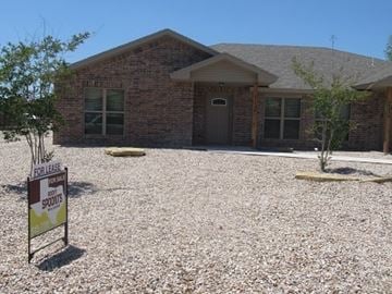 San Angelo house for rent - A house with a sign in front that says For Lease.