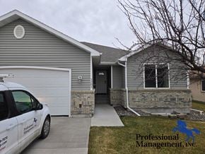 Billings house for rent - A car is parked in front of a house with a sign that says Professional Management, Inc.
