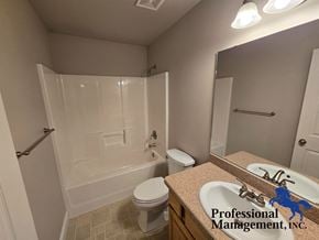 Billings house for rent - A bathroom with a toilet, sink, and bathtub.