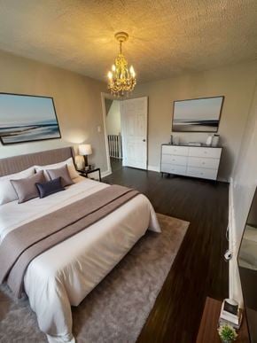 Cambridge apartment for rent - A bedroom with a large bed and a chandelier.