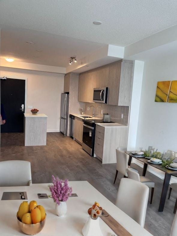 Kitchener house for rent - A modern kitchen with a dining table set for two.
