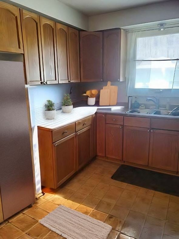 Cambridge house for rent - A kitchen with wooden cabinets and a tiled floor.