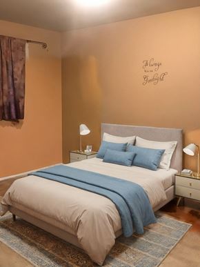 Cambridge house for rent - A bedroom with a bed, nightstands, and a lamp.
