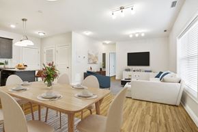 Shelton apartment for rent - A dining room with a wooden table set for four.