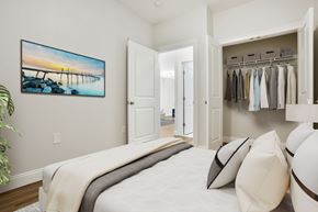 Shelton apartment for rent - A bedroom with a large bed and a painting on the wall.