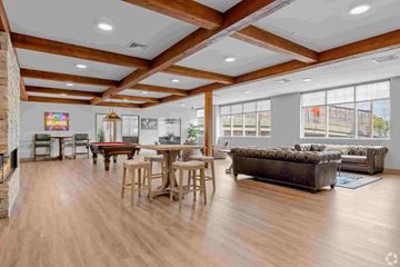 Shelton apartment for rent - A living room with a pool table and a couch.