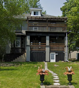 New Dundee apartment for rent - A house with a balcony and a white door.