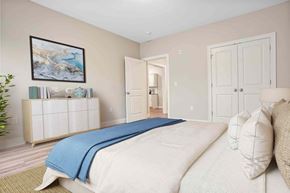 Shelton apartment for rent - A bedroom with a large bed and a painting on the wall.