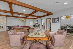 Shelton apartment for rent - A room with a pool table and a fireplace.