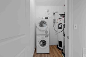 Shelton apartment for rent - A laundry room with a washer and dryer stacked on top of each other.