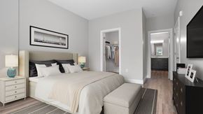 Shelton apartment for rent - A bedroom with a large bed and a picture frame on the wall.