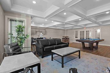 Shelton apartment for rent - A living room with a pool table and a couch.