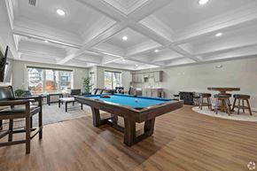 Shelton apartment for rent - A room with a pool table and bar stools.