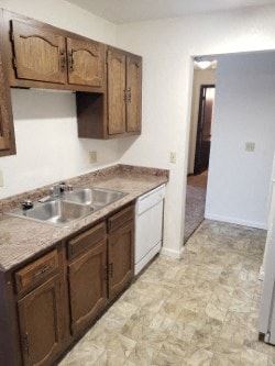 Anchorage apartment for rent - A kitchen with brown cabinets and a sink.