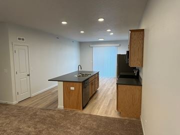 Grandview house for rent - A kitchen with a sink and a refrigerator.