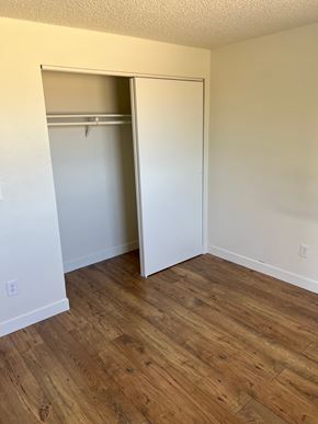 Benton City apartment for rent - A room with a white door and a wooden floor.