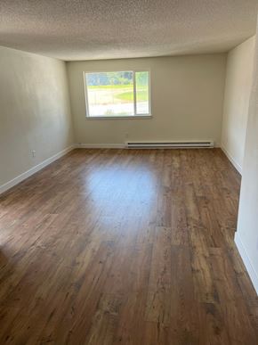 Benton City apartment for rent - A room with wooden flooring and a window.